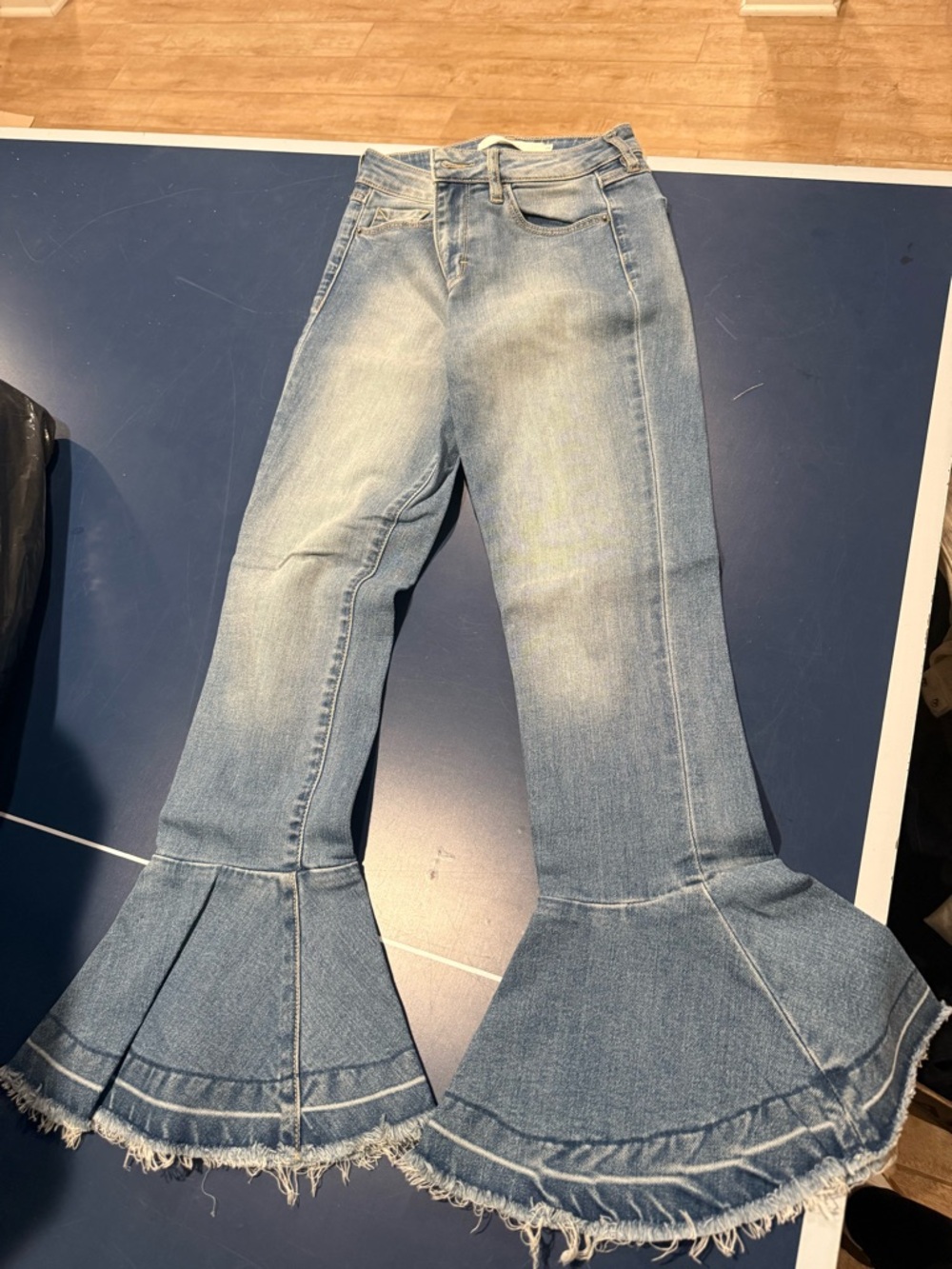 Light Wash Flare Jeans with Frayed Hem